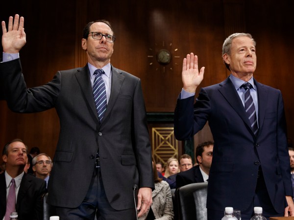AT&T Chairman and CEO Randall Stephenson, left, and Time Warner Chairman and CEO Jeffrey Bewkes are sworn in during a Senate Judiciary subcommittee hearing on the proposed merger between AT&T and Time Warner, on Capitol Hill, Wednesday, Dec. 7, 2016, in Washington. (AP Photo/Evan Vucci)