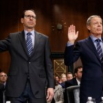 AT&T Chairman and CEO Randall Stephenson, left, and Time Warner Chairman and CEO Jeffrey Bewkes are sworn in during a Senate Judiciary subcommittee hearing on the proposed merger between AT&T and Time Warner, on Capitol Hill, Wednesday, Dec. 7, 2016, in Washington. (AP Photo/Evan Vucci)
