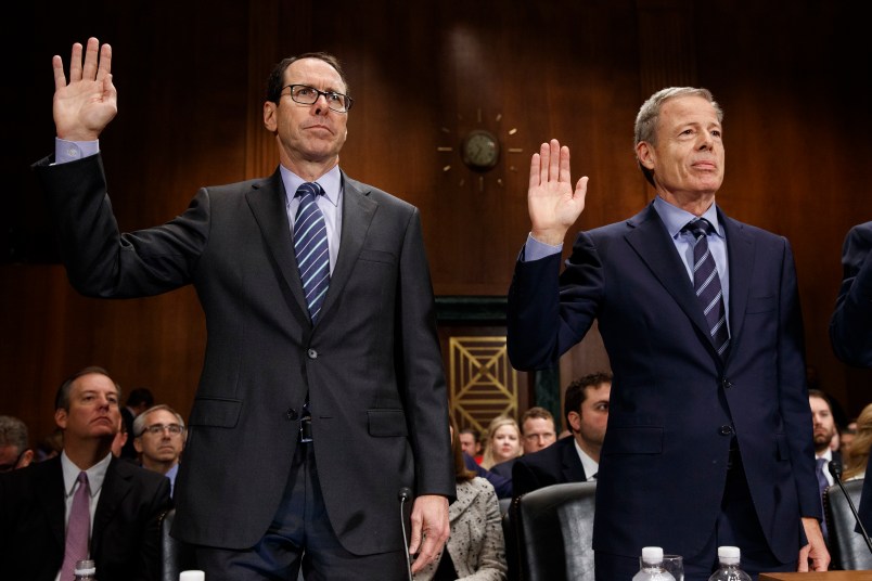 AT&T Chairman and CEO Randall Stephenson, left, and Time Warner Chairman and CEO Jeffrey Bewkes are sworn in during a Senate Judiciary subcommittee hearing on the proposed merger between AT&T and Time Warner, on Capitol Hill, Wednesday, Dec. 7, 2016, in Washington. (AP Photo/Evan Vucci)