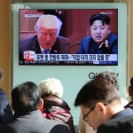 FILE- In this Tuesday, Nov. 21, 2017, file photo, people watch a TV screen showing images of U.S. President Donald Trump, left, and North Korean leader Kim Jong Un at Seoul Railway Station in Seoul, South Korea. North Korea has called on Wednesday, Nov. 22, 2017,Trump's decision to relist the country as a state sponsor of terrorism a "serious provocation" that justifies its development of nuclear weapons. The signs read "UN sanctions and The blow is not big." (AP Photo/Ahn Young-joon, File)