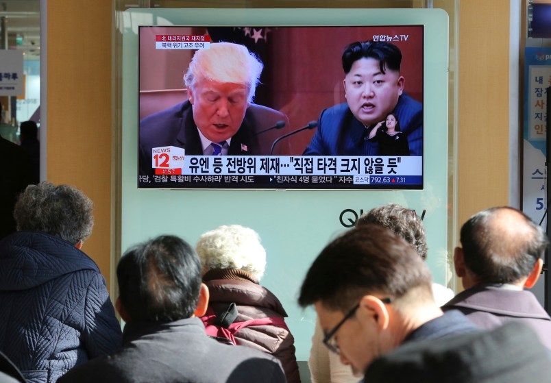 FILE- In this Tuesday, Nov. 21, 2017, file photo, people watch a TV screen showing images of U.S. President Donald Trump, left, and North Korean leader Kim Jong Un at Seoul Railway Station in Seoul, South Korea. North Korea has called on Wednesday, Nov. 22, 2017,Trump's decision to relist the country as a state sponsor of terrorism a "serious provocation" that justifies its development of nuclear weapons. The signs read "UN sanctions and The blow is not big." (AP Photo/Ahn Young-joon, File)