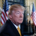 President Donald Trump pauses while speaking to the media before speaking with troops via video conference at Mar-a-Lago, on Thanksgiving, Thursday, Nov. 23, 2017, in Palm Beach, Fla. (AP Photo/Alex Brandon)