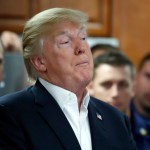 President Donald Trump speaks with members of the U.S. Coast Guard, at the Lake Worth Inlet Station, on Thanksgiving, Thursday, Nov. 23, 2017, in Riviera Beach, Fla. (AP Photo/Alex Brandon)