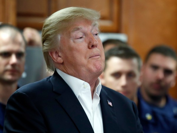 President Donald Trump speaks with members of the U.S. Coast Guard, at the Lake Worth Inlet Station, on Thanksgiving, Thursday, Nov. 23, 2017, in Riviera Beach, Fla. (AP Photo/Alex Brandon)