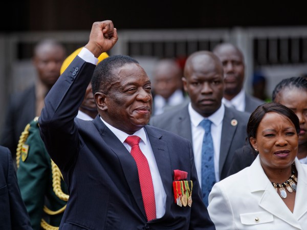 Emmerson Mnangagwa, center, and his wife Auxillia, right, arrive at the presidential inauguration ceremony in the capital Harare, Zimbabwe Friday, Nov. 24, 2017. Mnangagwa is being sworn in as Zimbabwe’s president after Robert Mugabe resigned on Tuesday, ending his 37-year rule. (AP Photo/Ben Curtis)