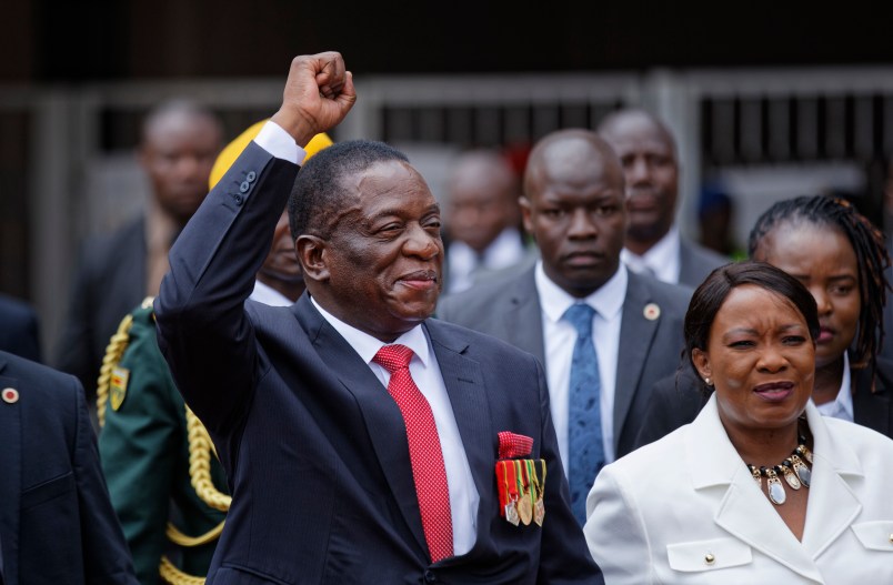 Emmerson Mnangagwa, center, and his wife Auxillia, right, arrive at the presidential inauguration ceremony in the capital Harare, Zimbabwe Friday, Nov. 24, 2017. Mnangagwa is being sworn in as Zimbabwe’s president after Robert Mugabe resigned on Tuesday, ending his 37-year rule. (AP Photo/Ben Curtis)