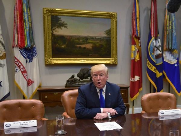 President Donald Trump, flanked by empty seats for Senate Minority Leader Sen. Chuck Schumer of N.Y., left, and House Minority Leader Nancy Pelosi of Calif., right, speaks in the Roosevelt Room of the White House in Washington, Tuesday, Nov. 28, 2017, during a meeting with Republican congressional leaders. (AP Photo/Susan Walsh)