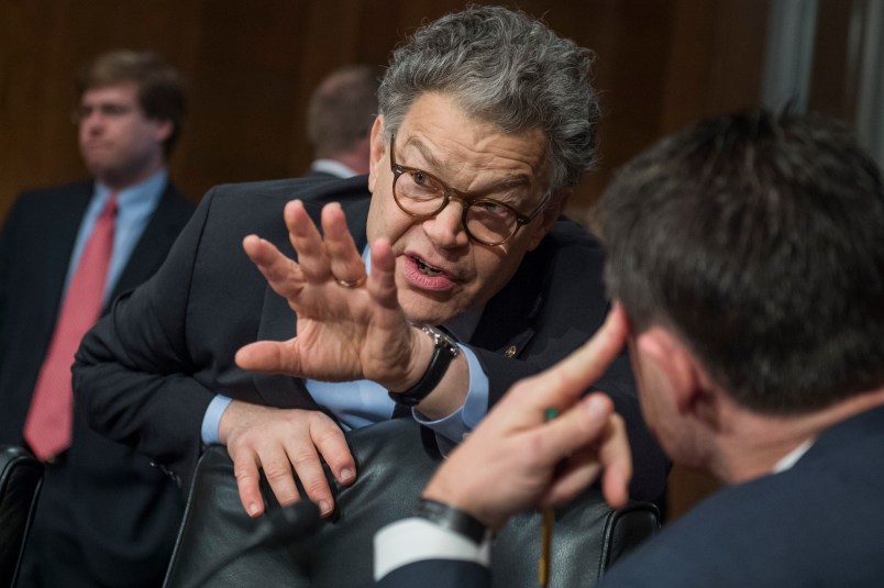 UNITED STATES - OCTOBER 19: Sen. Al Franken, D-Minn., left, talks with Sen. Todd Young, R-Ind., during a Senate Health, Education, Labor and Pensions Committee hearing in Dirksen Building titled "Examining How Healthy Choices Can Improve Health Outcomes and Reduce Costs," on October 19, 2017. (Photo By Tom Williams/CQ Roll Call)