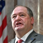 Kentucky Speaker of the House Jeff Hoover looks up to the cheers from the gallery following his swearing in, Tuesday, Jan. 3, 2017, in Frankfort, Ky. Hoover is the first Republican Speaker since 1921. (AP Photo/Timothy D. Easley)
