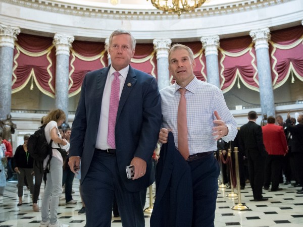 Rep. Mark Meadows, R-N.C., chairman of the conservative House Freedom Caucus, and Rep. Jim Jordan, R-Ohio, a key member of the group, walk through Statuary Hall at the Capitol in Washington, Wednesday, Sept. 13, 2017. With President Donald Trump wanting a legislative solution to replace the Deferred Action for Childhood Arrivals program, Meadows has said he will put together a working group to craft a conservative immigration plan. (AP Photo/J. Scott Applewhite)