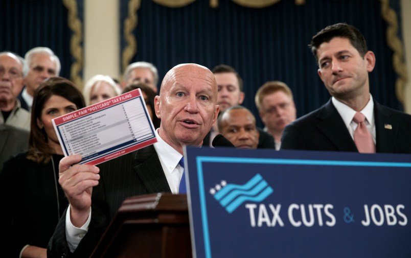 House Ways and Means Committee Chairman Kevin Brady, R-Texas, joined by Speaker of the House Paul Ryan, R-Wis., right, holds a proposed "postcard tax filing form" as they unveil the GOP's far-reaching tax overhaul, the first major revamp of the tax system in three decades, on Capitol Hill in Washington, Thursday, Nov. 2, 2017.  (AP Photo/J. Scott Applewhite)