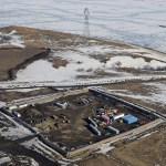 FILE - This Feb. 13, 2017, aerial file photo shows a site where the final phase of the Dakota Access Pipeline near the Missouri River took place with boring equipment routing the pipeline underground and across Lake Oahe to connect with the existing pipeline in Emmons County in Cannon Ball, N.D. A federal judge on Monday, Dec. 4, 2017, ordered the Army Corps of Engineers and pipeline developer Energy Transer Partners to complete an oil spill response plan for a section of the pipeline beneath the Missouri River in North Dakota. (Tom Stromme/The Bismarck Tribune via AP, File)