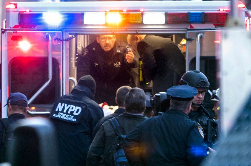 NYPD and FDNY officials place suspect  Akayed Ullah, on a stretcher, into the back of an ambulance on 8th Ave. between 42nd and 43rd Streets, Monday, Dec. 11, 2017 in New York. Ullah set off a crude pipe bomb strapped to his body in a crowded subway corridor near Times Square, injuring the man, slightly wounding three others and sending New York commuters fleeing in terror through the smoky passageway. (Craig Ruttle/Newsday via AP)