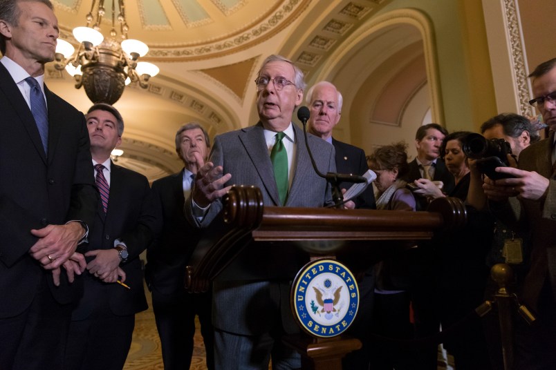 Senate Majority Leader Mitch McConnell, R-Ky., center, joined by, from left, Sen. John Thune, R-S.D., Sen. Cory Gardner, R-Colo., Sen. Roy Blunt, R-Mo., and Majority Whip John Cornyn, R-Texas, speaks to reporters about the GOP tax bill following a closed-door strategy session on Capitol Hill in Washington, Tuesday, Dec. 12, 2017.  (AP Photo/J. Scott Applewhite)