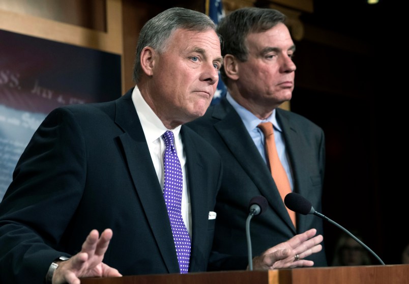 Senate Select Committee on Intelligence Chairman Richard Burr, R-N.C., left, and Vice Chairman Mark Warner, D-Va., update reporters on the status of their inquiry into Russian interference in the 2016 U.S. elections, at the Capitol in Washington, Wednesday, Oct. 4, 2017. Burr says the committee has interviewed more than 100 witnesses as part of its investigation and that more work still needs to be done. (AP Photo/J. Scott Applewhite)