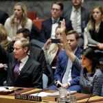 Matthew Rycroft, left, Britain's ambassador to the U.N. and U.S. Ambassador Nikki Haley vote in favor of a resolution, Friday, Dec. 22, 2017, at United Nations headquarters. The council is voting on proposed new sanctions against North Korea, including sharply lower limits on its refined oil imports, the return home of all North Koreans working overseas within 12 months, and a crackdown on the country's shipping. (AP Photo/Mark Lennihan)