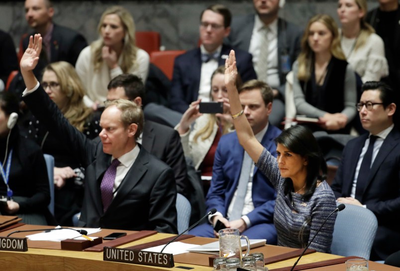 Matthew Rycroft, left, Britain's ambassador to the U.N. and U.S. Ambassador Nikki Haley vote in favor of a resolution, Friday, Dec. 22, 2017, at United Nations headquarters. The council is voting on proposed new sanctions against North Korea, including sharply lower limits on its refined oil imports, the return home of all North Koreans working overseas within 12 months, and a crackdown on the country's shipping. (AP Photo/Mark Lennihan)