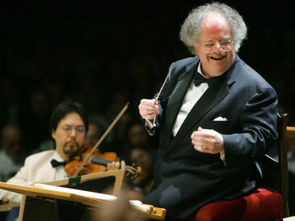 This photo taken July 7, 2006 shows Boston Symphony Orchestra music director James Levine, right, conducting the symphony on its opening night performance at Tanglewood in Lenox., Mass. This was Levine's first appearance since injuring his shoulder in an onstage fall in March 2006. (AP Photo/Michael Dwyer)
