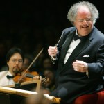 This photo taken July 7, 2006 shows Boston Symphony Orchestra music director James Levine, right, conducting the symphony on its opening night performance at Tanglewood in Lenox., Mass. This was Levine's first appearance since injuring his shoulder in an onstage fall in March 2006. (AP Photo/Michael Dwyer)