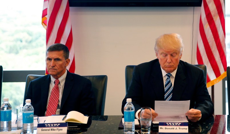 Republican presidential candidate Donald Trump, conducts a roundtable discussion on national security in his offices in Trump Tower in New York, Wednesday, Aug. 17, 2016. Left is Ret. Army Gen. Mike Flynn and right is Ret. Army Lt. Gen. Keith Kellogg. (AP Photo/Gerald Herbert)