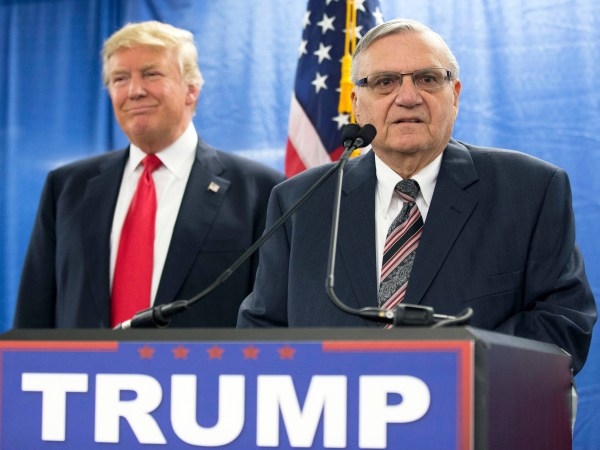 FILE - In this Jan. 26, 2016, file photo, then-Republican presidential candidate Donald Trump is joined by Joe Arpaio, the then sheriff of metro Phoenix, during a news conference in Marshalltown, Iowa. The former Phoenix-area sheriff who was pardoned by President Donald Trump from his federal contempt-of-court conviction in an immigration case is experiencing a wobbly return to the public speaking circuit.In Las Vegas, security concerns prompted event planners to move Arpaio’s scheduled weekend appearance to an undisclosed location away from the casino-lined Strip tourist district. (AP Photo/Mary Altaffer, File)