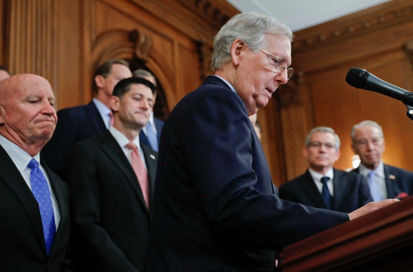 Senate Majority Leader Mitch McConnell, R-Ky., center, walks up to the podium as he is joined by from l-r., Rep. Kevin Brady, R-Texas, Speaker of the House Paul Ryan, R-Wis., Rep. David Schweikert, R-Ariz., and Charles Grassley, R-Iowa, as they meet with reporters to announce the Republicans' proposed rewrite of the tax code for individuals and corporations, at the Capitol in Washington, Wednesday, Sept. 27, 2017. President Donald Trump and congressional Republicans are writing a far-reaching, $5-trillion plan they say would simplify the tax system and nearly double the standard deduction used by most Americans. (AP Photo/Pablo Martinez Monsivais)