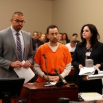 Dr. Larry Nassar, 54, appears in court for a plea hearing in Lansing, Mich., Wednesday, Nov. 22, 2017. Nasser, a sports doctor accused of molesting girls while working for USA Gymnastics and Michigan State University pleaded, guilty to multiple charges of sexual assault and will face at least 25 years in prison.(AP Photo/Paul Sancya)