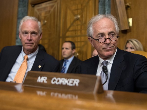 Senate Budget Committee members Sen. Bob Corker, R-Tenn., right, and Sen. Ron Johnson, R-Wis., left  attend a Senate Budget Committee hearing to consider fiscal year 2018 reconciliation legislation on Capitol Hill in Washington, Tuesday, Nov. 28, 2017. The Senate Budget Committee has advanced a sweeping tax package to the full Senate, handing GOP leaders a victory as they try to pass the nation's first tax overhaul in 31 years. (AP Photo/Carolyn Kaster)