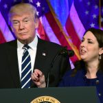 President Donald Trump, left, listens as Republican Nantional Committee chairwoman Ronna Romney McDaniel, right, speaks at a fundraiser at Cipriani in New York, Saturday, Dec. 2, 2017. Trump is attending a trio of fundraisers during his day in New York. (AP Photo/Susan Walsh)