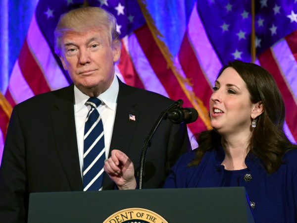 President Donald Trump, left, listens as Republican Nantional Committee chairwoman Ronna Romney McDaniel, right, speaks at a fundraiser at Cipriani in New York, Saturday, Dec. 2, 2017. Trump is attending a trio of fundraisers during his day in New York. (AP Photo/Susan Walsh)
