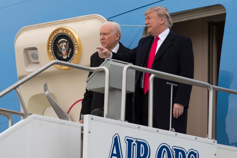 President Donald Trump stands with Sen. Orrin Hatch, R-Utah, after arriving at Salt Lake City International Airport, Monday, Dec. 4, 2017, in Salt Lake City. (AP Photo/Evan Vucci)