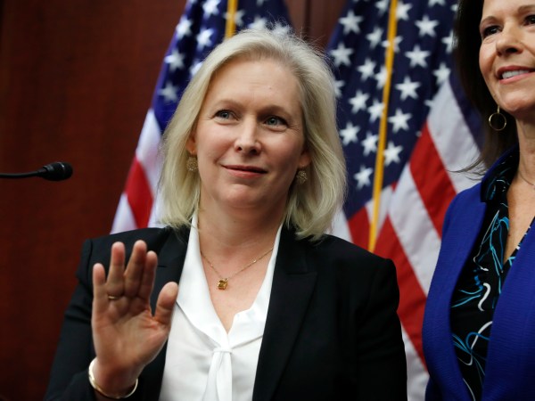 Sen. Kirsten Gillibrand, D-N.Y., left, tells reporters to wait until the end to ask questions about her statement on Sen. Al Franken, D-Minn., while attending a news conference on sexual harassment in the workplace, Wednesday, Dec. 6, 2017, on Capitol Hill in Washington. At right is Rep. Cheri Bustos, D-Illinois. (AP Photo/Jacquelyn Martin)