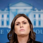 White House press secretary Sarah Huckabee Sanders listens to a reporter's question during a press briefing at the White House, Tuesday, Dec. 12, 2017, in Washington. (AP Photo/Alex Brandon)