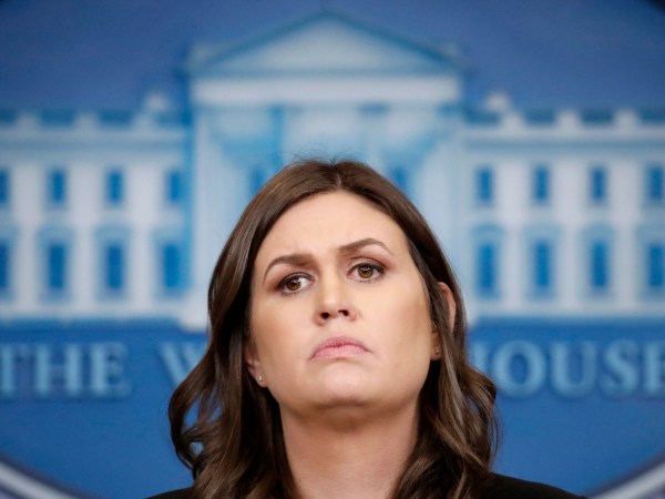 White House press secretary Sarah Huckabee Sanders listens to a reporter's question during a press briefing at the White House, Tuesday, Dec. 12, 2017, in Washington. (AP Photo/Alex Brandon)