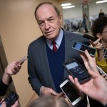 Reporters seek a comment from Sen. Richard C. Shelby, R-Ala., a critic of Alabama Republican Roy Moore who is running for the Senate in a special election, on Capitol Hill in Washington, Tuesday, Dec. 12, 2017.  (AP Photo/J. Scott Applewhite)