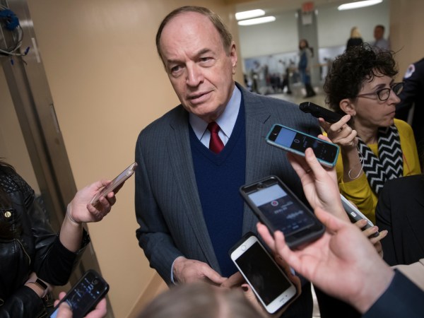 Reporters seek a comment from Sen. Richard C. Shelby, R-Ala., a critic of Alabama Republican Roy Moore who is running for the Senate in a special election, on Capitol Hill in Washington, Tuesday, Dec. 12, 2017.  (AP Photo/J. Scott Applewhite)