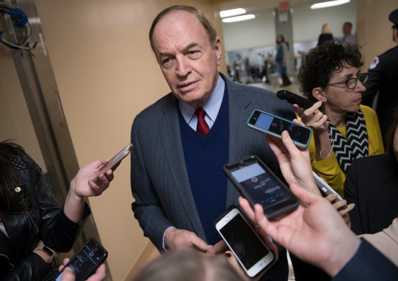 Reporters seek a comment from Sen. Richard C. Shelby, R-Ala., a critic of Alabama Republican Roy Moore who is running for the Senate in a special election, on Capitol Hill in Washington, Tuesday, Dec. 12, 2017.  (AP Photo/J. Scott Applewhite)