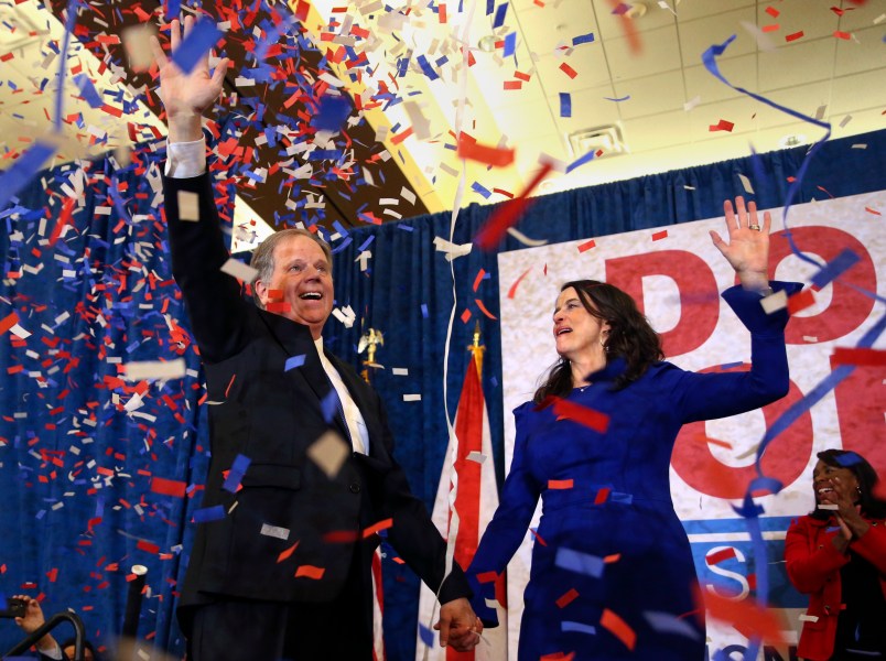 Democratic candidate for U.S. Senate Doug Jones and his wife Louise wave to supporters before speaking during an election-night watch party Tuesday, Dec. 12, 2017, in Birmingham , Ala. Jones is facing Republican Roy Moore. (AP Photo/John Bazemore)