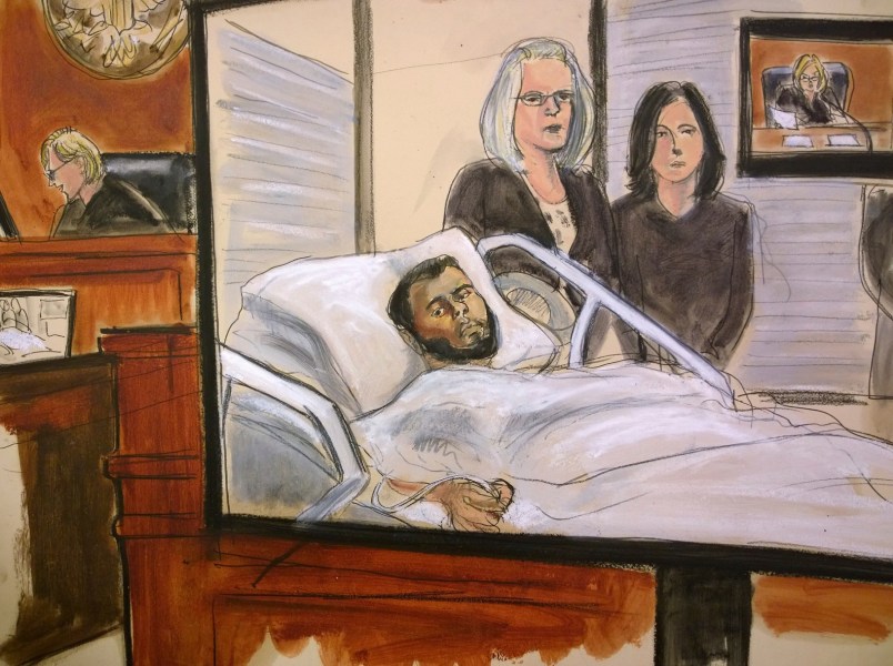 In this court room drawing, defendant Akayed Ullah is seen on a video monitor from his hospital room, joined by his attorneys, federal defenders Amy Gallicchio, left and Juliet Gatto, Wednesday, Dec. 13, 2017 in New York. On the bench at left and on the video monitor at right is Magistrate Judge Katherine Parker. Ullah, 27, is accused of detonating a pipe bomb that was strapped to his body on Monday, Dec. 11, 2017, in a pedestrian tunnel linking two busy subway stations near New York City's Port Authority bus terminal. Only he was seriously injured. (Elizabeth Williams via AP)