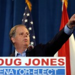 Democrat speaks Doug Jones speaks during a news conference Wednesday, Dec. 13, 2017, in Birmingham, Ala.  (AP Photo/John Bazemore)