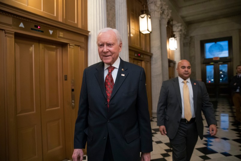 Senate Finance Committee Chairman Orrin Hatch, R-Utah, walks to the chamber as Republicans in the House and Senate plan to pass the sweeping $1.5 trillion GOP tax bill on party-line votes, at the Capitol in Washington, Monday, Dec. 18, 2017. (AP Photo/J. Scott Applewhite)