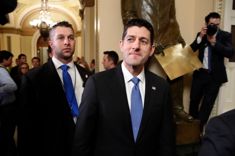 House Speaker Paul Ryan of Wis., center, leaves the House Chamber after voting yes on the Republican tax bill, Tuesday, Dec. 19, 2017, on Capitol Hill in Washington. (AP Photo/Jacquelyn Martin)