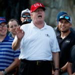 President Donald Trump speaks as he meets with members of the Coast Guard who he invited to play golf at Trump International Golf Club, Friday, Dec. 29, 2017, in West Palm Beach, Fla. (AP Photo/Evan Vucci)
