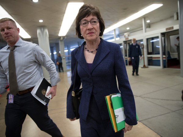 Sen. Susan Collins, R-Maine, arrives for a caucus meeting as the Republican majority in Congress prepares to vote on the biggest reshaping of the U.S. tax code in three decades, on Capitol Hill, in Washington, Tuesday, Dec. 19, 2017. (AP Photo/J. Scott Applewhite)
