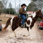 U.S. Senate candidate Roy Moore rides a horse to vote during the Alabama senatorial election, Tuesday, Dec. 12, 2017, in Gallant, Ala. (AP Photo/Brynn Anderson)