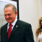 Former Alabama Chief Justice and U.S. Senate candidate Roy Moore walks in to speak at a press conference, Thursday, Nov. 16, 2017, in Birmingham, Ala. (AP Photo/Brynn Anderson)