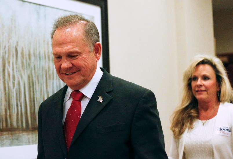 Former Alabama Chief Justice and U.S. Senate candidate Roy Moore walks in to speak at a press conference, Thursday, Nov. 16, 2017, in Birmingham, Ala. (AP Photo/Brynn Anderson)