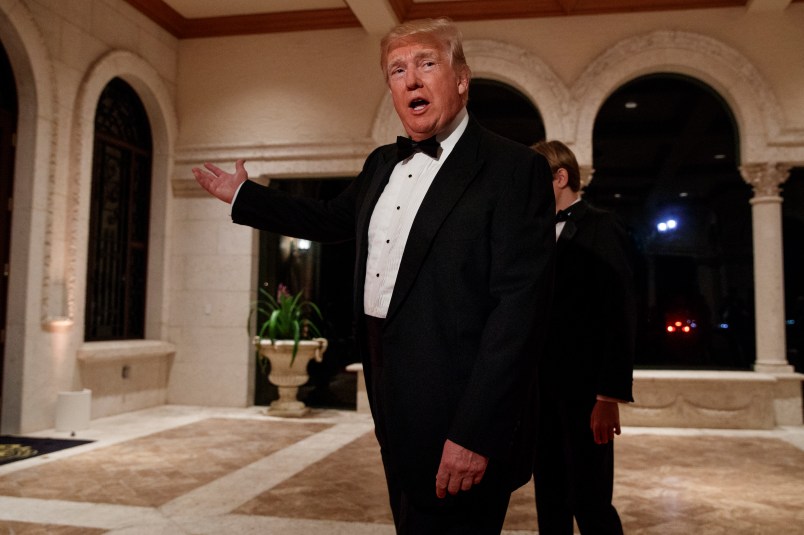 President Donald Trump speaks with reporters as he arrives for a New Year's Eve gala at his Mar-a-Lago resort, Sunday, Dec. 31, 2017, in Palm Beach, Fla. (AP Photo/Evan Vucci)