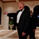 President Donald Trump speaks with reporters as he arrives for a New Year's Eve gala at his Mar-a-Lago resort, Sunday, Dec. 31, 2017, in Palm Beach, Fla. (AP Photo/Evan Vucci)
