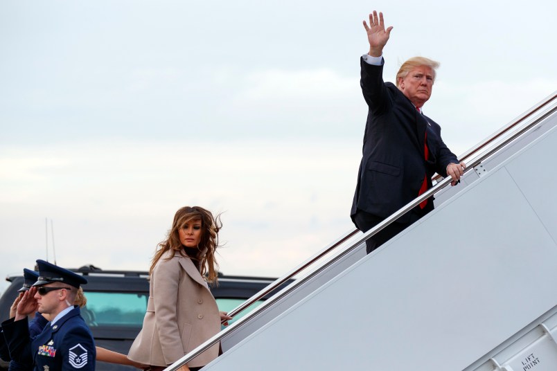 President Donald Trump and first lady Melania Trump board Air Force One at Palm Beach International Airport, Monday, Jan. 1, 2018, in West Palm Beach, Fla. (AP Photo/Evan Vucci)